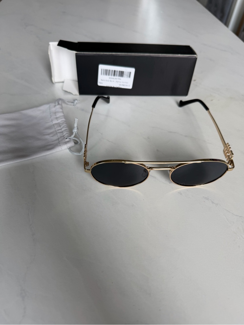 Gold Frame Oval Sunglasses with Black Lenses